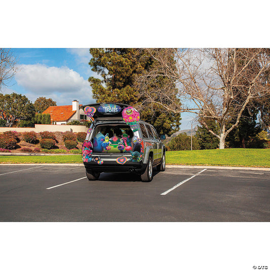 SUV in a parking lot with its trunk decorated using the Trolls Treat Your Trunk kit, wide view